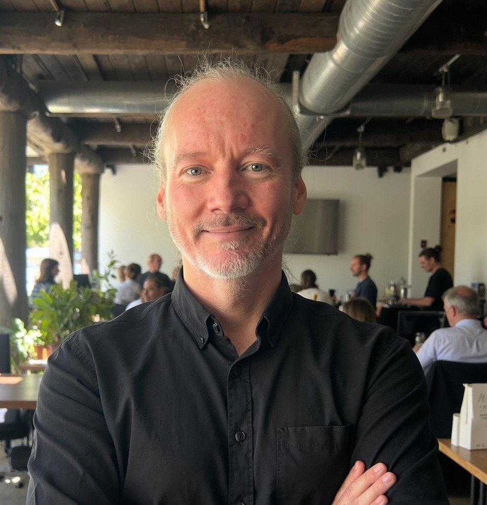 Portrait of Mike Merlin, Co-Founder and Software Engineering Lead of PracForms